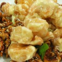 Walnut Prawns · Prawns crisp-sautéed in a tangy white cream sauce and topped with honeyed walnuts.