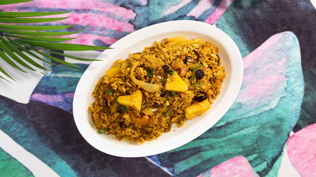 Pineapple Fried Rice · Vegan fried rice with onions, pineapple, cashews, and your choice of tofu or vegetables.
