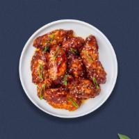Sesame St. Garlic Wings · Fresh chicken wings breaded, fried until golden brown, and tossed in sesame garlic sauce.