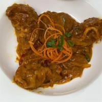 Allepy Curry Veg momos · Tofu and Vegetables stuffed dumplings tossed in house made masala and coconut milk sauce, se...