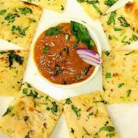 Spicy Masala Bites · Naan Bread loaded with Garlic, celantro, green chili, tandoori masala and cumin.