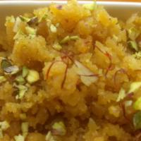 Moong Dal Halwa
 · Yellow lentils mash, cooked in ghee Topped with caramelized peanuts.