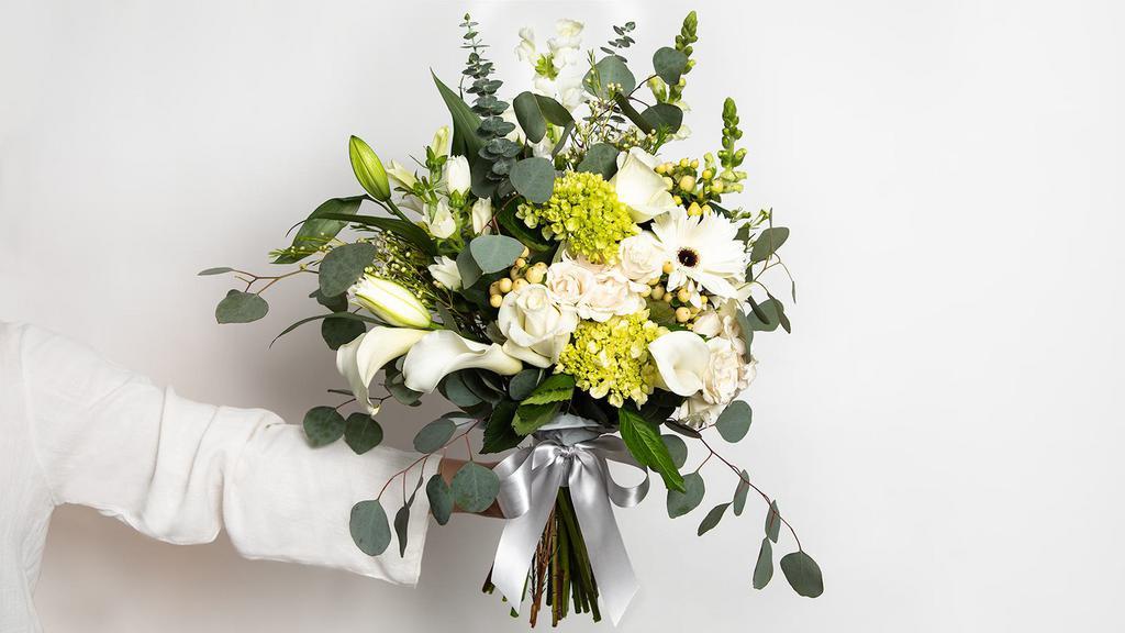 Whispery White Large Bouquet · Roses, spray roses, gerberas, double lilies, mini hydrangeas, callas, snap dragons, fillers and greens.