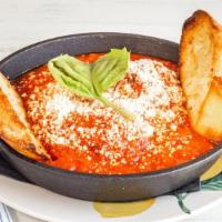 Polpette Della Mamma · Wagyu beef meatballs, tomato sauce, Parmigiano-Reggiano and house-made crostini.