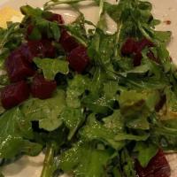 Insalata Tricolore · Vegetarian. Wild arugula, red beets, burrata, EVOO, lemon dressing and balsamic.