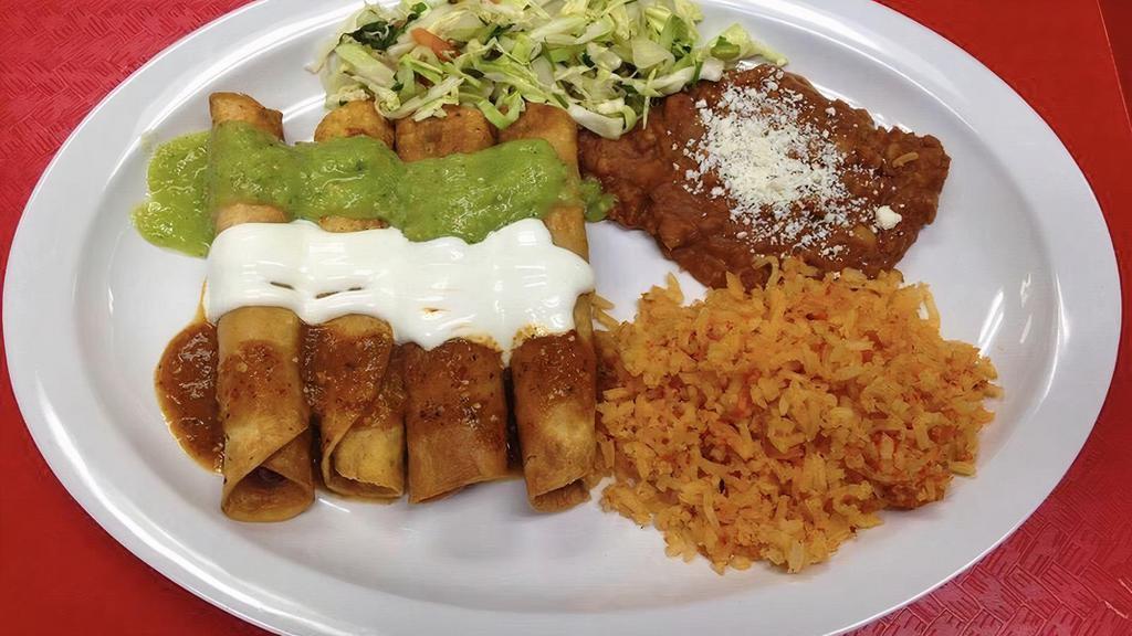 Flautas · 4 chicken flautas with a side of beans and rice.