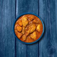 Capital Chicken Curry · Bone in chicken pieces simmered in brown onion and tomato curry, seasoned with fresh herbs a...