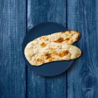 Naked Naan · A refined flour leavened flatbread, baked in a clay oven till crisp on the outside and soft ...