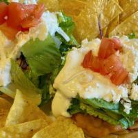 Sopes · 2 pieces. 2 small corn patties topped with beans, choice of meat, lettuce, sour cream, queso...