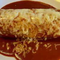 Regular Burrito Mojado · Regular burrito topped with enchilada sauce and cheese.