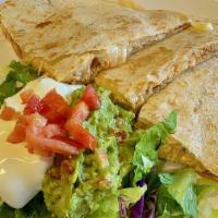 Super Quesadilla · Choice of meat quesadilla with lettuce, guacamole, and sour cream on the side.