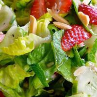 Side Salad · Spring mix garnished with fresh tomatoes, mushrooms and choice of raw onions, hot and/or swe...