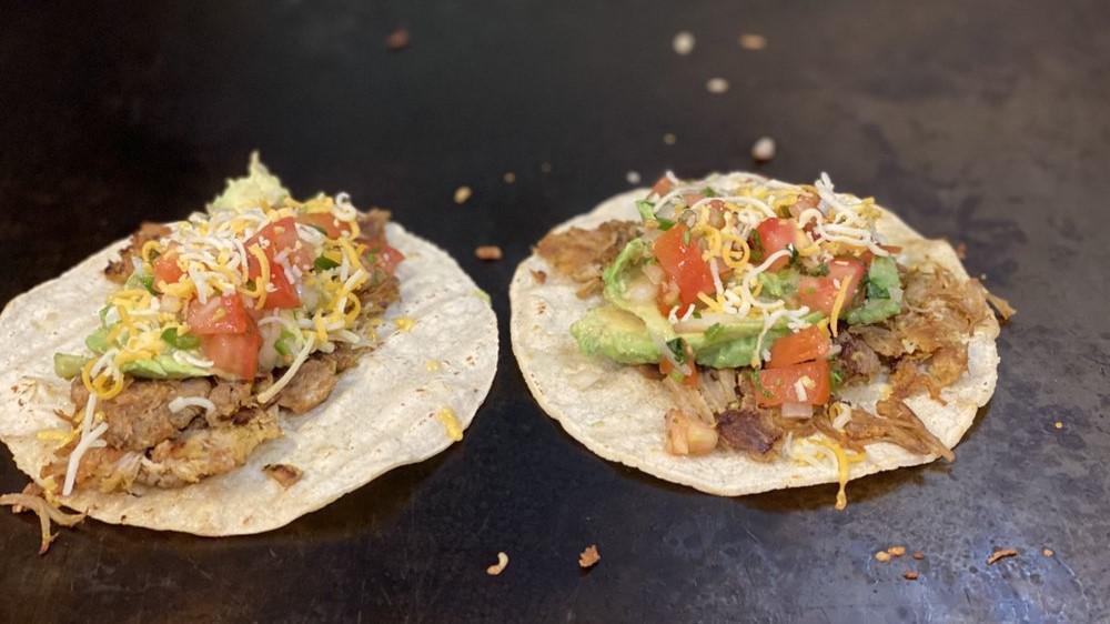 Taco · Your choice of meat with diced onion, cilantro, and salsa