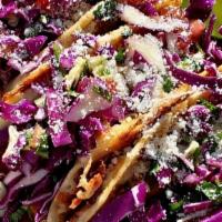 OG Shrimp Taco · Corn Quesadilla topped w/ Jack Cheese, Homeade Chorizo, Shrimp, Cabbage Salad (Cabbage Salad...