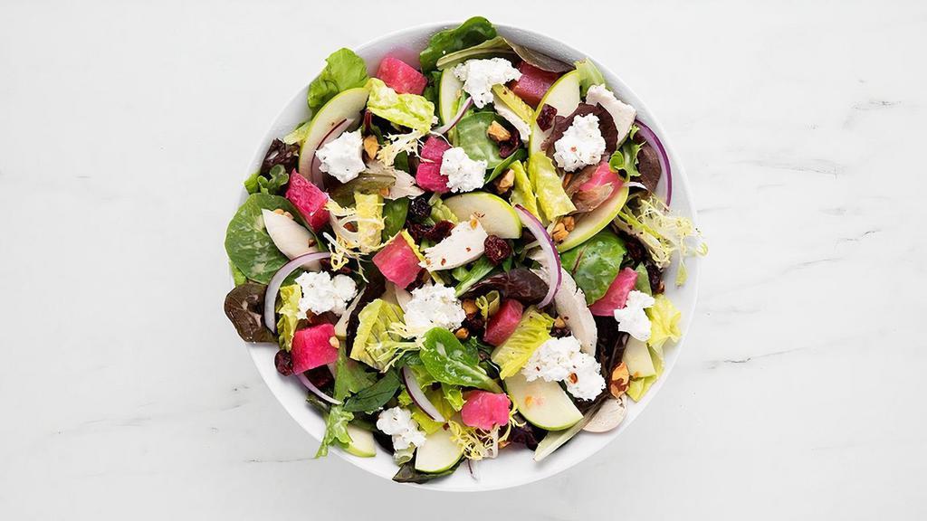 Pink Lady Beets & Goat Cheese Salad · Shaved, roasted chicken breast, honey and herb marinated goat cheese, pink lady beets, green apples, dried cranberries, crushed honey roasted almonds, red onions, mixed greens, chopped romaine (620 cal) with citrus vinaigrette (220 cal). gluten free