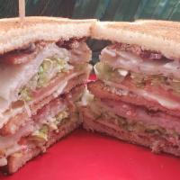Turkey Club · Roasted turkey breast, thick cut bacon, jack, tomato, lettuce and mayo on 3 toasted slices o...