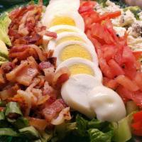 Cobb Salad · Avocado, bacon, blue  cheese, tomatoes,  hard boiled egg on romaine hearts and iceberg lettu...