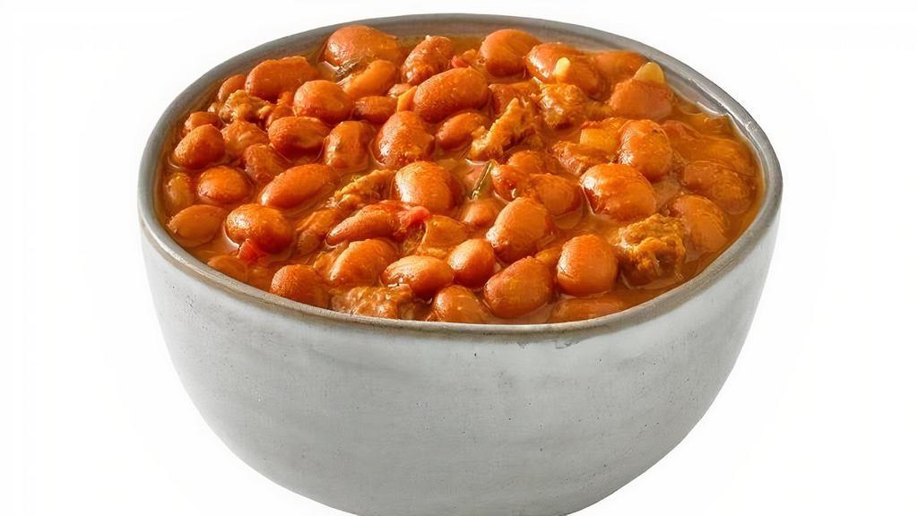 Campero Beans · Slowly Cooked Pinto Beans. Made with Chorizo, Onions, Garlic, Diced Tomato, Cilantro and Jalapenos.