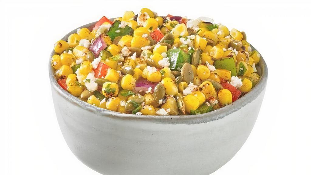 Corn Salad · Roasted Corn & Peppers Tossed with Pumpkin Seeds, Feta Cheese, Cilantro and White Shallot Vinaigrette.