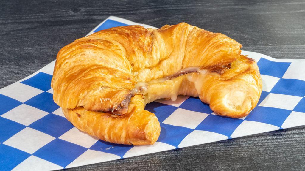 Hot Ham & Swiss Croissant · Buttery croissant, melty cheese and a honey mustard sauce.