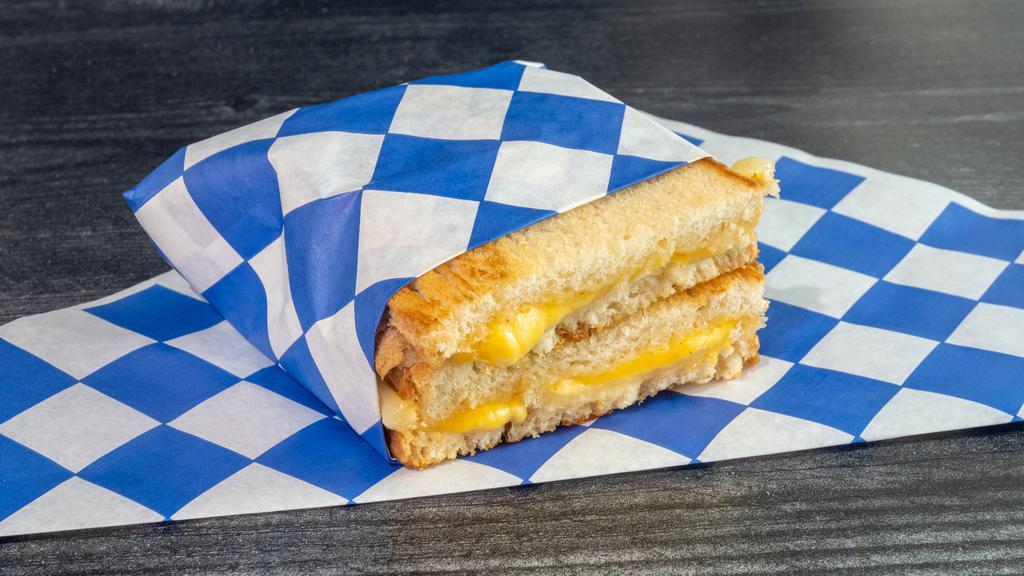 Grilled Cheese Sandwich · Swiss and American cheeses, butter, mayo, sliced sourdough.