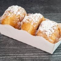 Beginets · This Yummy trio mini beignet is filled with three different kind  hazelnut, white chocolate ...