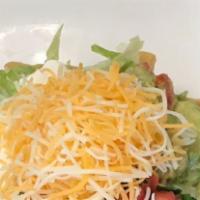 Taco Salad · Mecican white rice,  choice of beans, cheese, lettuce, sour cream, and choice of meats (beef...