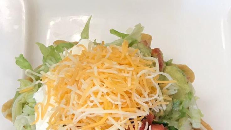 Taco Salad · Mecican white rice,  choice of beans, cheese, lettuce, sour cream, and choice of meats (beef,  grilled chicken, or carnitas, Al Pastor, Chipotle Chicken, Fajita Veggie), with choice of dressing.