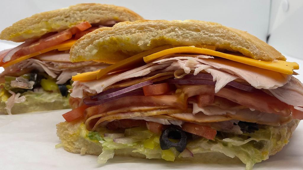 Harvest Turkey · Harvest Turkey sandwich put on your choice of toasted bread with your choice of cheese. Topped with lettuce, tomato, olives, jalepeños, banana peppers, pickles, mayonnaise, and mustard.