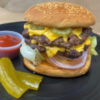 Double Cheese Burger · Two beef patties, american cheese, lettuce, tomatoes, mustard, mayonnaise and pickles.