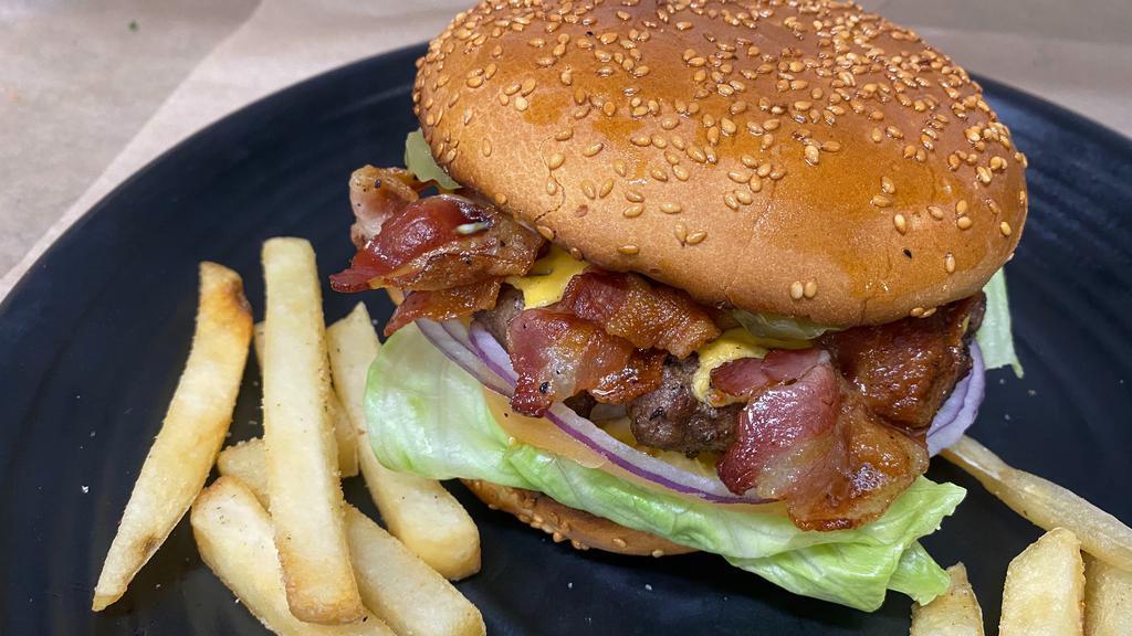 Bacon Cheese Burger · Beef patty, bacon, american cheese, lettuce, tomatoes, mustard, mayonnaise and pickles.