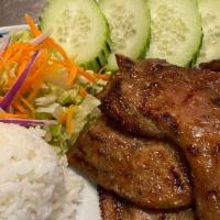 36. BBQ Pork · Grilled marinated pork with honey sauce served with sweet sauce and Thai herbs.