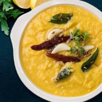 Simply Dal Tadka · Yellow lentil with aromatic garlic and cumin flavor.