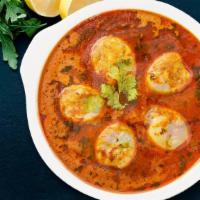 Guddu (Egg) Curry · Soft boiled eggs cooked in onion tomato gravy.