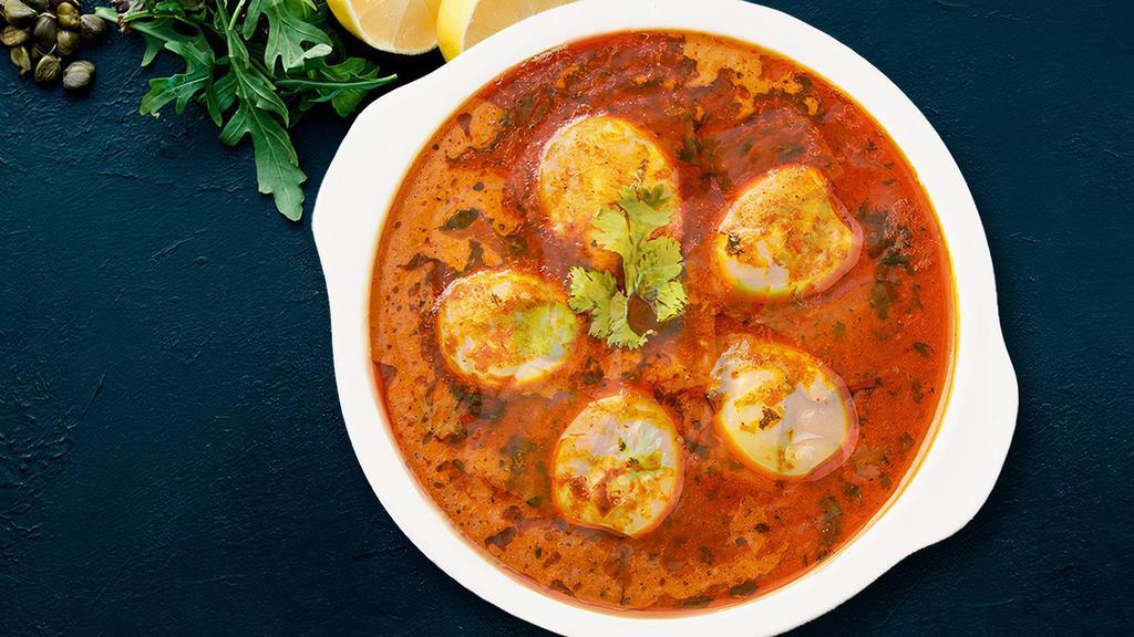 Guddu (Egg) Curry · Soft boiled eggs cooked in onion tomato gravy.