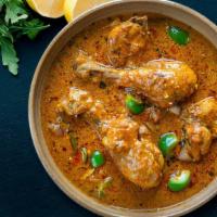 Fb'S Chicken Curry · Chicken prepared with special sauce from fresh onions, tomatoes, garlic, cloves, and other s...