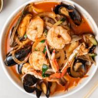 Seafood Jjamppong · House special spicy noodle soup 
(crab, clam, squid, mussel, shrimp, & vegetables).