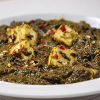 Palak Paneer · Classic vegetarian indian dish made with spinach in slowly cooked spinach curry.