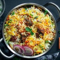 Lamb Biryani · Slowly cooked lamb in basmati rice and indian flavored spices.