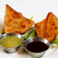 Samosa · 2 pieces of deep fried indian pastries filled with potatoes and peas.