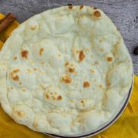 Naan · Cooked in clay oven.