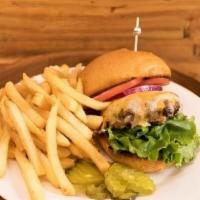 Cheeseburger Meal · 6 oz Angus Ground Chuck Burger Topped with Cheddar Cheese Served with French Fries .