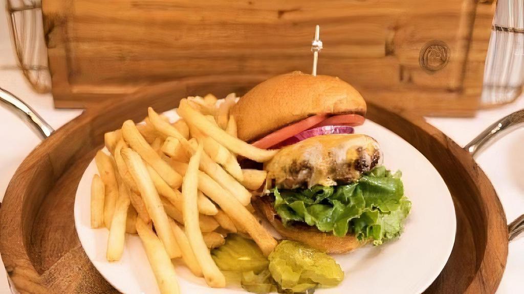 Cheeseburger Meal · 6 oz Angus Ground Chuck Burger Topped with Cheddar Cheese Served with French Fries .