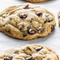 Chocolate Chip Cookies · Four freshly baked chocolate chip cookies