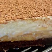 Thickum Cheesecake Slice · Vanilla cheesecake layers of brownie, dulce de leche, and walnuts