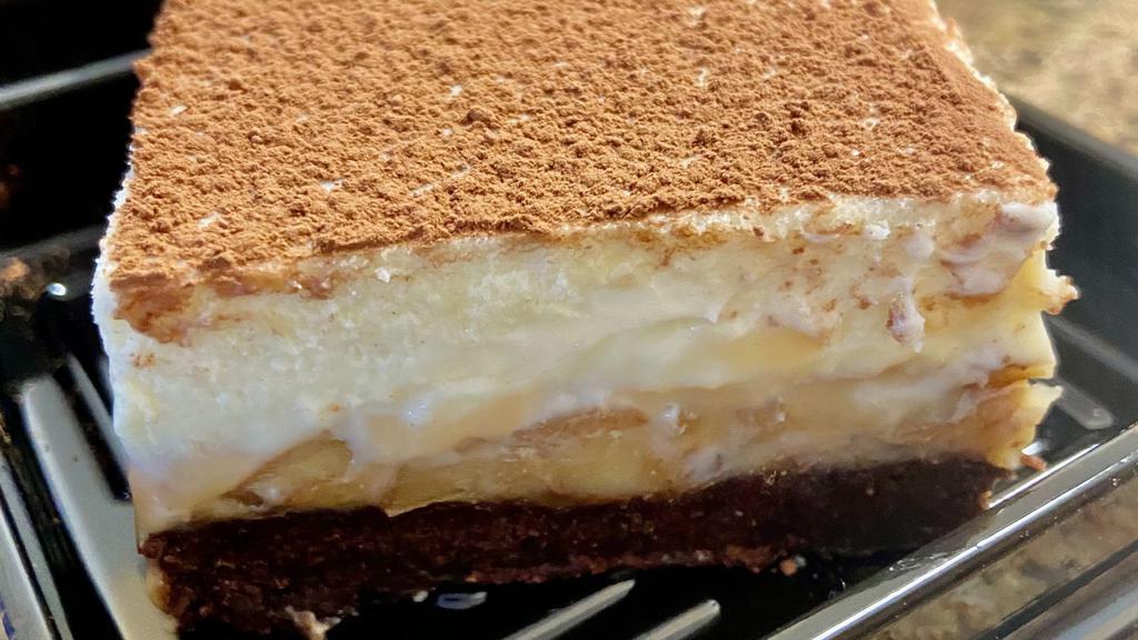 Thickum Cheesecake Slice · Vanilla cheesecake layers of brownie, dulce de leche, and walnuts