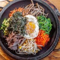 B2. Dol Pan Bi Bim Bab(돌판 비빔밥) · Rice with mixed vegetable, beef on stone pot.