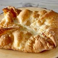 Penovani Khachapuri · Golden, crunchy layered puff pastry dough with cheese.