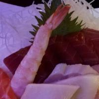 Chirashi · Sliced fresh raw fish over sushi rice served with miso soup and salad.