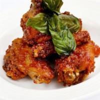 Spicy Angel Wings · Available in deep fried crispy tofu. Deep fried chicken wings sauteed with our signature chi...